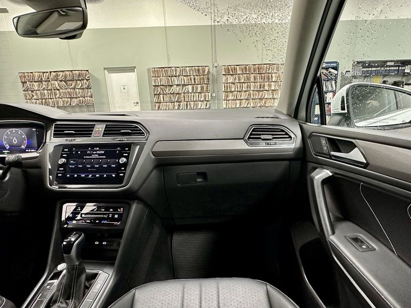 2023 Volkswagen Tiguan SE w/Sunroof & 3rd Row in a Opal White Pearl exterior color and Black Heated Seatsinterior. Schmelz Countryside SAAB (888) 558-1064 stpaulsaab.com 