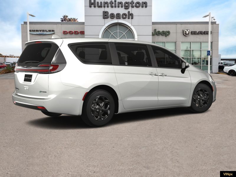 2023 Chrysler Pacifica Hybrid Touring L in a Bright White exterior color and Blackinterior. BEACH BLVD OF CARS beachblvdofcars.com 