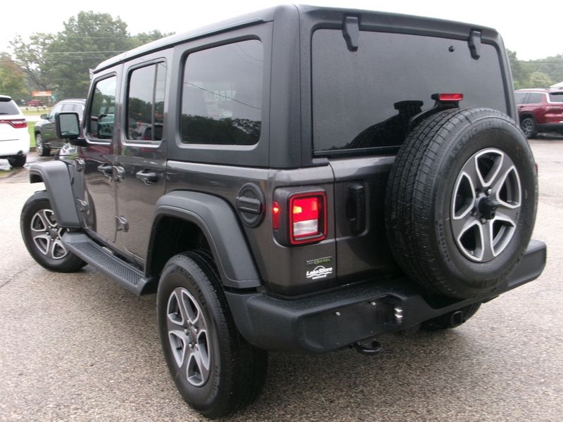 2022 Jeep Wrangler Unlimited Sport S in a Granite Crystal Metallic Clear Coat exterior color and Blackinterior. Lakeshore Chrysler Jeep Dodge (231) 500-5209 lakeshorechryslerjeep.com 