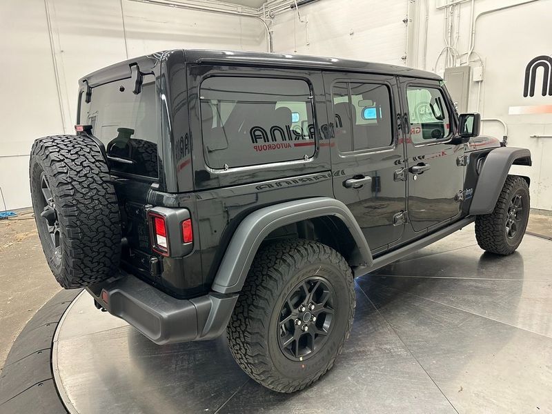 2024 Jeep Wrangler 4-door Willys 4xe in a Black Clear Coat exterior color and Blackinterior. Marina Auto Group (855) 564-8688 marinaautogroup.com 