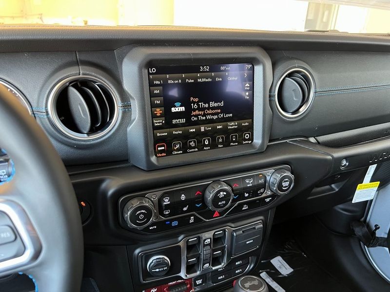 2023 Jeep Wrangler Rubicon 4xe in a Silver Zynith Clear Coat exterior color and Blackinterior. Marina Chrysler Dodge Jeep RAM (855) 616-8084 marinadodgeny.com 