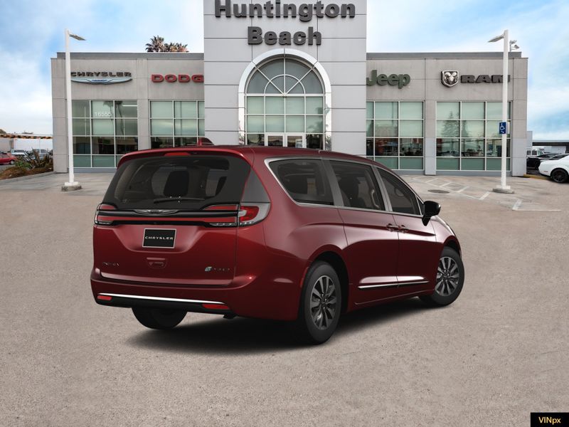 2023 Chrysler Pacifica Hybrid Limited in a Velvet Red Pearl Coat exterior color and Black/Alloy/Blackinterior. BEACH BLVD OF CARS beachblvdofcars.com 