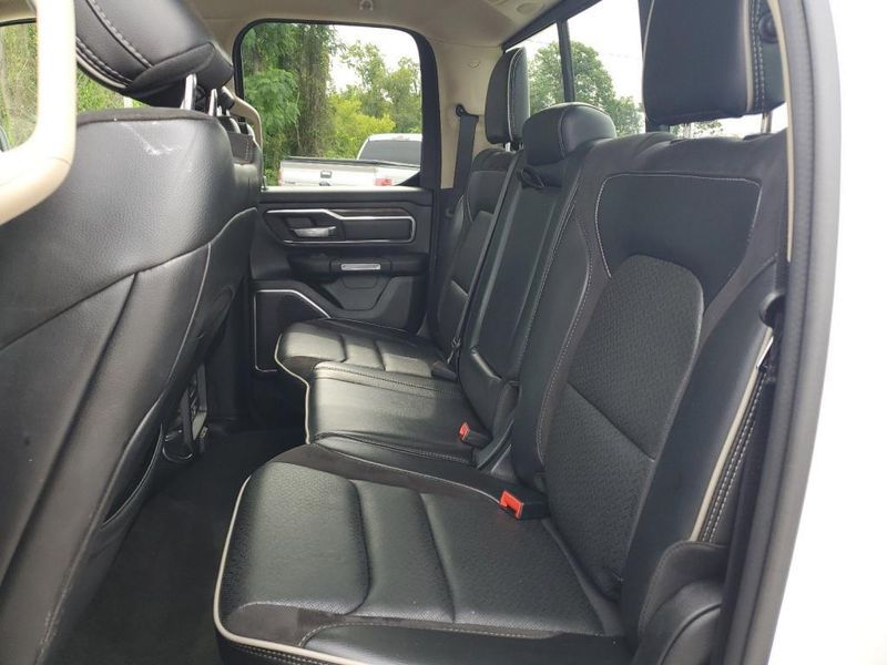 2020 RAM 1500 Laramie in a Bright White Clear Coat exterior color and Blackinterior. Johnson Dodge 601-693-6343 pixelmotiondemo.com 
