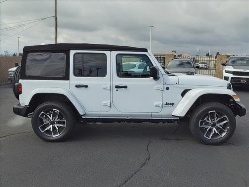 2024 Jeep Wrangler Sport S 4xe in a Bright White Clear Coat exterior color and Blackinterior. Perris Valley Auto Center 951-657-6100 perrisvalleyautocenter.com 