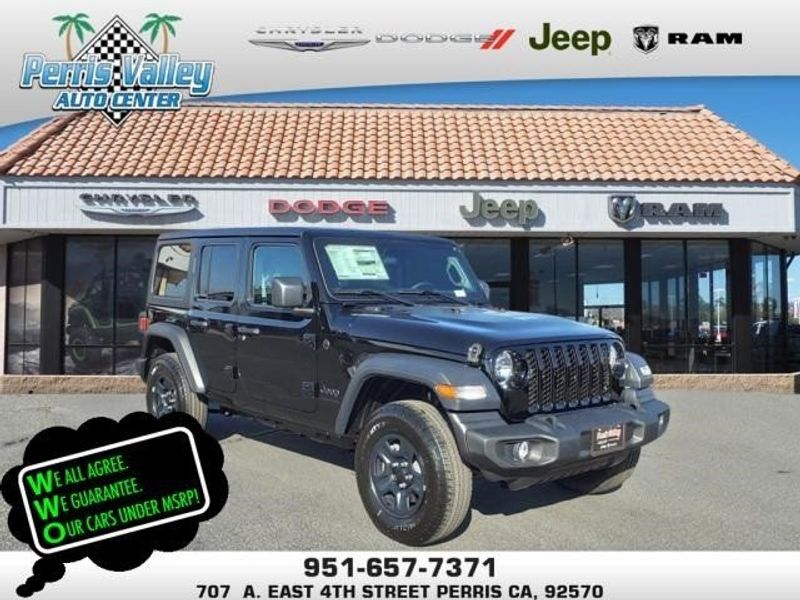 2024 Jeep Wrangler Sport in a Black Clear Coat exterior color and Blackinterior. Perris Valley Auto Center 951-657-6100 perrisvalleyautocenter.com 