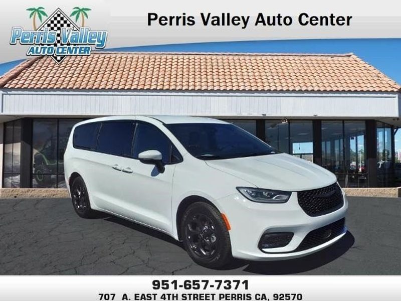 2023 Chrysler Pacifica Hybrid Touring L in a Bright White Clear Coat exterior color and Blackinterior. Perris Valley Kia 951-657-6100 perrisvalleykia.com 