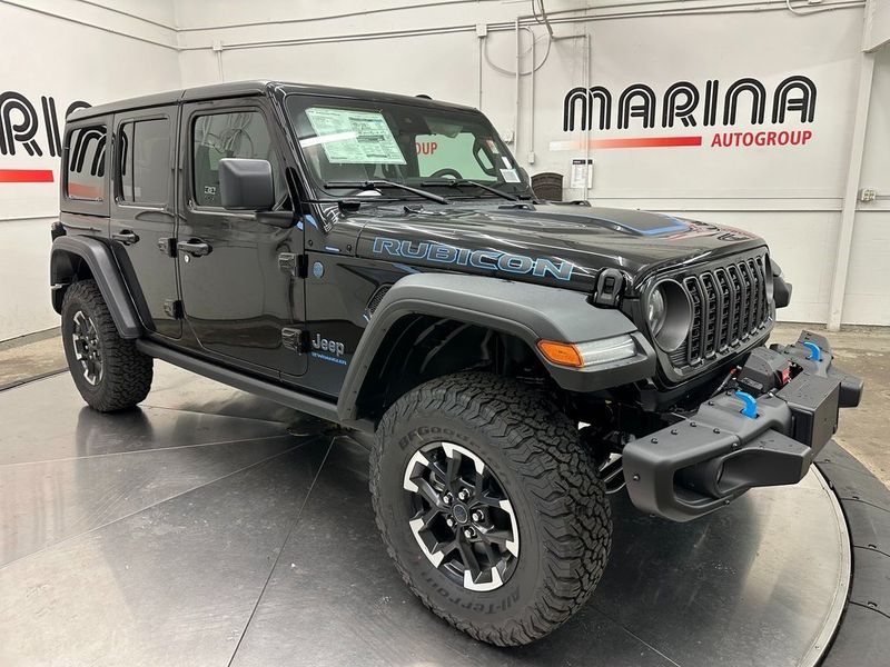 2024 Jeep Wrangler 4-door Rubicon 4xe in a Black Clear Coat exterior color and Blackinterior. Marina Auto Group (855) 564-8688 marinaautogroup.com 