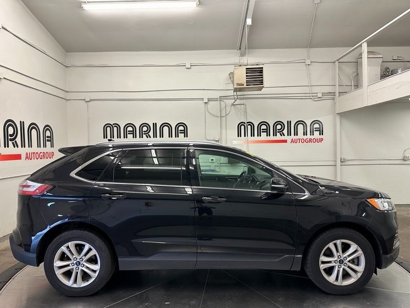 2020 Ford Edge SEL in a Agate Black exterior color and Ebonyinterior. Marina Chrysler Dodge Jeep RAM (855) 616-8084 marinadodgeny.com 