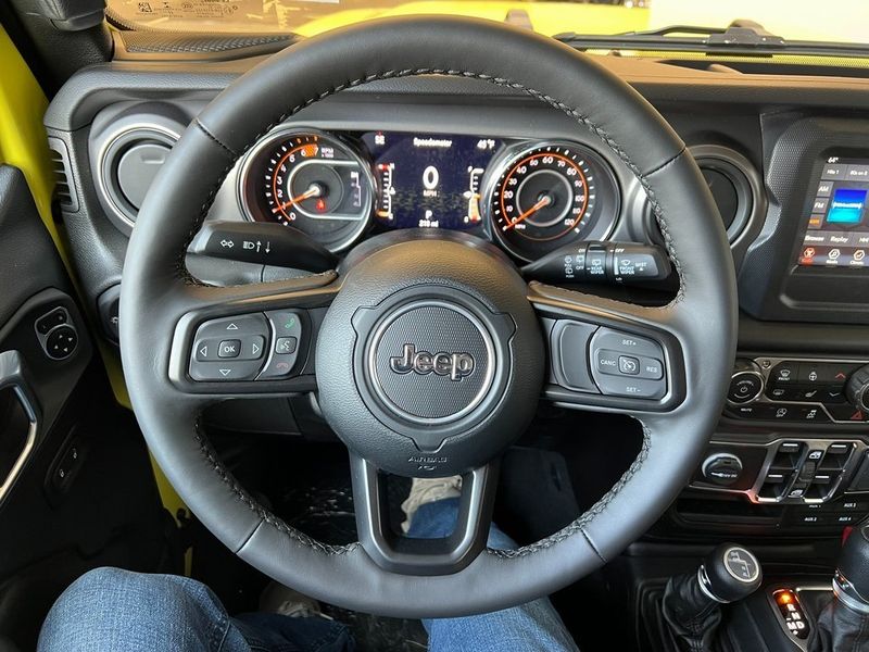 2023 Jeep Wrangler 4-door Sport S 4x4 in a High Velocity Clear Coat exterior color and Blackinterior. Marina Chrysler Dodge Jeep RAM (855) 616-8084 marinadodgeny.com 