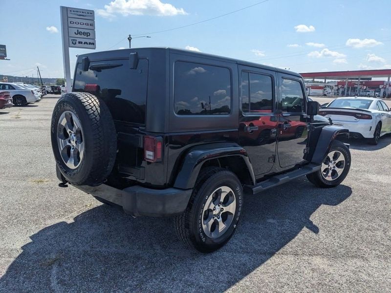 2017 Jeep Wrangler Unlimited Sahara in a Black Clear Coat exterior color and Blackinterior. Johnson Dodge 601-693-6343 pixelmotiondemo.com 