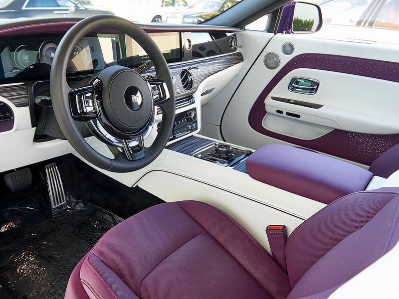 2024 Rolls-Royce Spectre  in a Twilight Purple exterior color and Arctic Whiteinterior. SHELLY AUTOMOTIVE shellyautomotive.com 