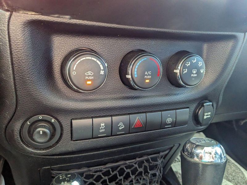 2017 Jeep Wrangler Unlimited Sahara in a Black Clear Coat exterior color and Blackinterior. Johnson Dodge 601-693-6343 pixelmotiondemo.com 