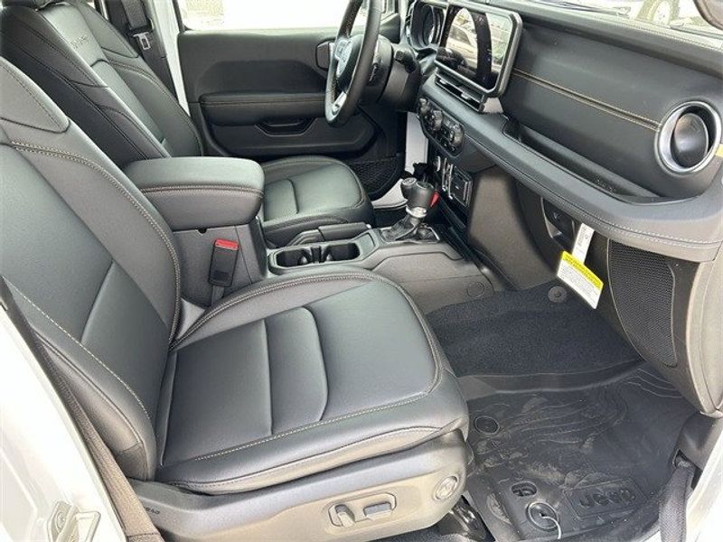 Jeep Wrangler 4xE Sahara in a Bright White Clear Coat exterior color and Blackinterior. McPeek