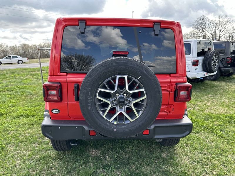 2024 Jeep Wrangler 4-door Sahara in a Firecracker Red Clear Coat exterior color. Gupton Motors Inc 615-384-2886 guptonmotors.com 