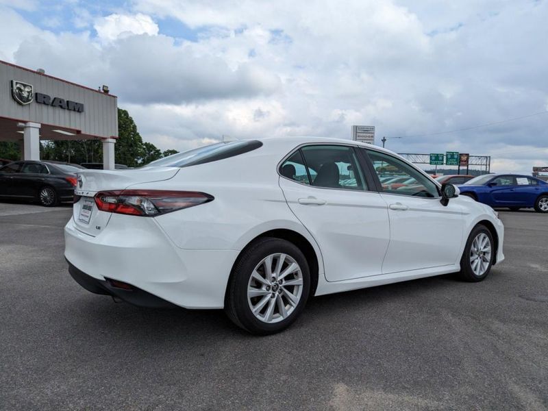 2022 Toyota Camry LE in a WHITE exterior color. Johnson Dodge 601-693-6343 pixelmotiondemo.com 