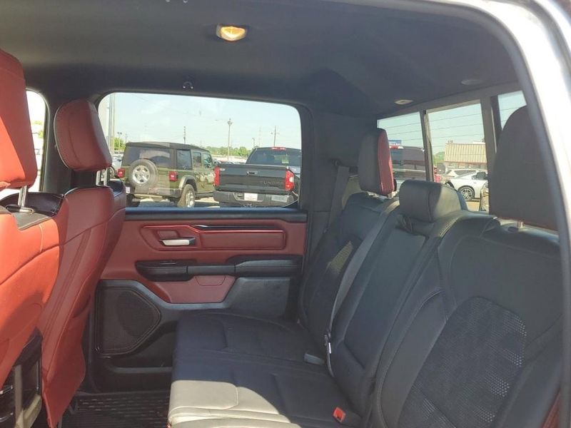 2020 RAM 1500 Rebel in a Granite Crystal Metallic Clear Coat exterior color and Red/Blackinterior. Johnson Dodge 601-693-6343 pixelmotiondemo.com 