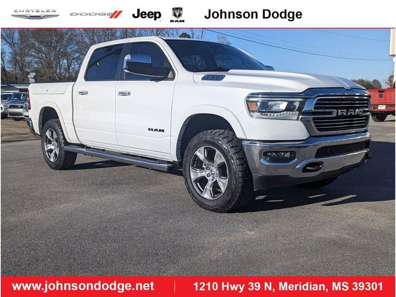 2021 RAM 1500 Laramie in a Bright White Clear Coat exterior color and Light Frost Beige/Mountain Browninterior. Johnson Dodge 601-693-6343 pixelmotiondemo.com 