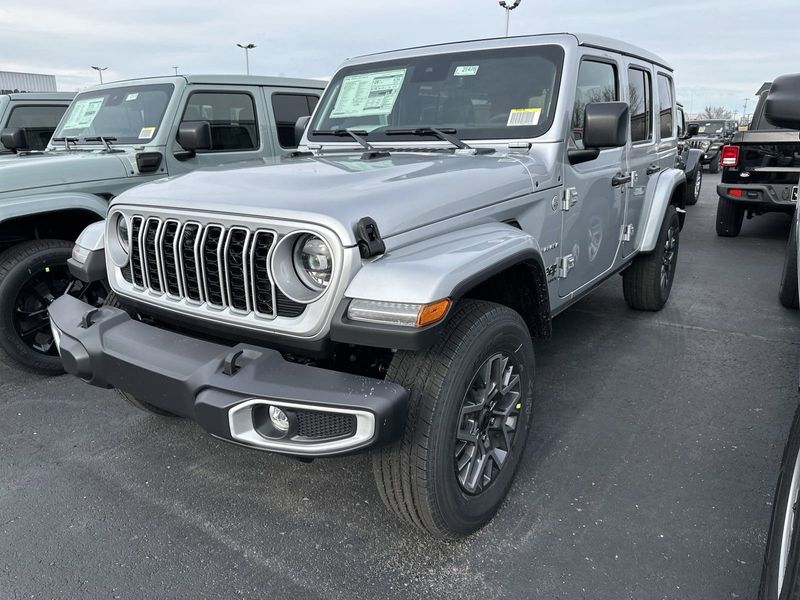 2024 Jeep Wrangler 4-door Sahara in a Silver Zynith Clear Coat exterior color and Blackinterior. CDJR of Anytown 949-555-4321 pixelmotiondemo.com 