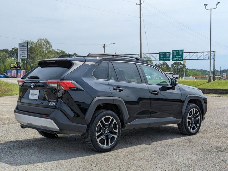 2021 Toyota RAV4 Adventure in a Midnight Black Metallic exterior color. Johnson Dodge 601-693-6343 pixelmotiondemo.com 