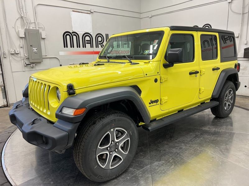 2023 Jeep Wrangler 4-door Sport S 4x4 in a High Velocity Clear Coat exterior color and Blackinterior. Marina Chrysler Dodge Jeep RAM (855) 616-8084 marinadodgeny.com 