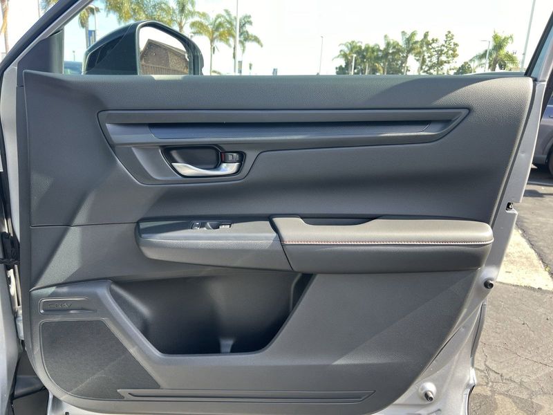 2024 Honda CR-V Hybrid Sport-L in a Silver exterior color. BEACH BLVD OF CARS beachblvdofcars.com 