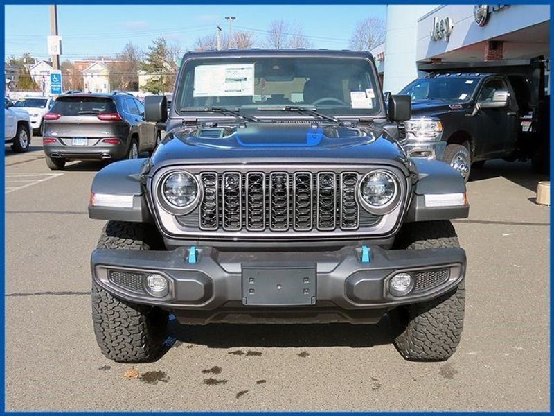 2024 Jeep Wrangler 4xE 4-DOOR RUBICON 4xe in a Granite Crystal Metallic Clear Coat exterior color. Papas Jeep Ram In New Britain, CT 860-356-0523 papasjeepram.com 