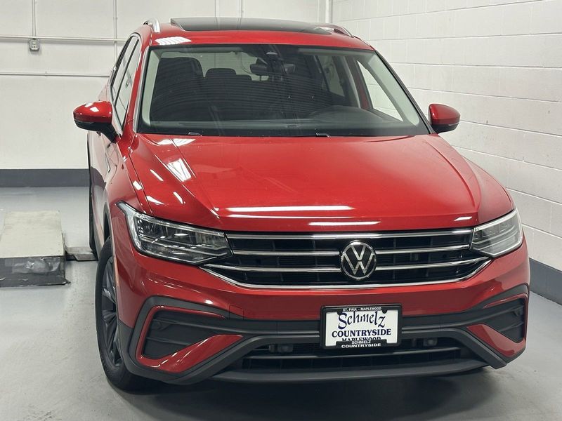 2023 Volkswagen Tiguan SE w/Sunroof & 3rd Row in a Kings Red Metallic exterior color and Black Heated Seatsinterior. Schmelz Countryside Alfa Romeo and Fiat (651) 968-0556 schmelzfiat.com 