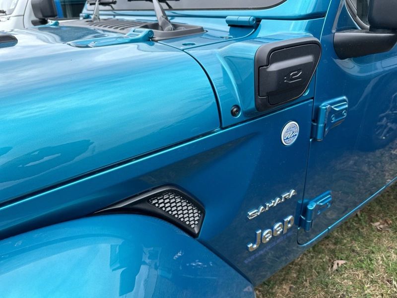 2024 Jeep Wrangler 4-door Sahara 4xe in a Bikini Pearl Coat exterior color. Gupton Motors Inc 615-384-2886 guptonmotors.com 