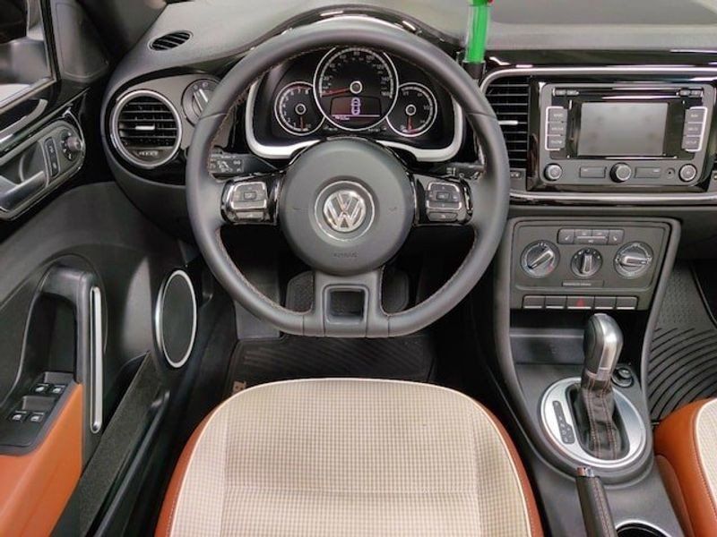 2015 VOLKSWAGEN BEETLE CONVERTIBLE 1.8T CLASSIC W/NAV in a Black Uni/Black Roof exterior color and Beige/Brown Checkered Heated Seatsinterior. Schmelz Countryside SAAB (888) 558-1064 stpaulsaab.com 