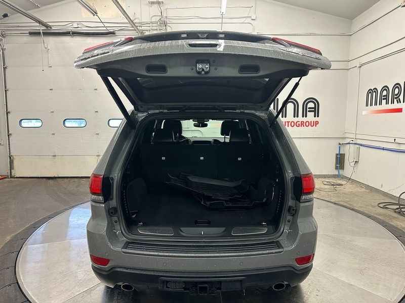 2021 Jeep Grand Cherokee Trailhawk in a Sting-Gray Clear Coat exterior color and Blackinterior. Marina Chrysler Dodge Jeep RAM (855) 616-8084 marinadodgeny.com 