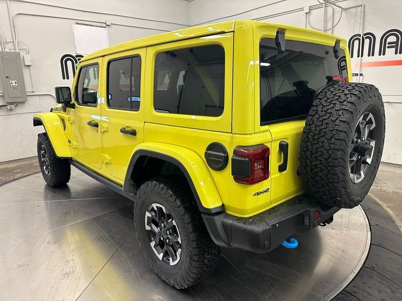 2024 Jeep Wrangler 4-door Rubicon X 4xe in a High Velocity Clear Coat exterior color and Blackinterior. Marina Auto Group (855) 564-8688 marinaautogroup.com 