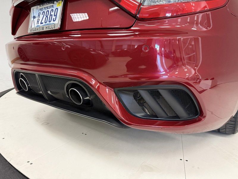 2018 Maserati GranTurismo MC in a Rosso Trionfale Metallic exterior color and Bianco Pregiatointerior. Karma Newport Beach (844) 527-6262 karmanb.com 