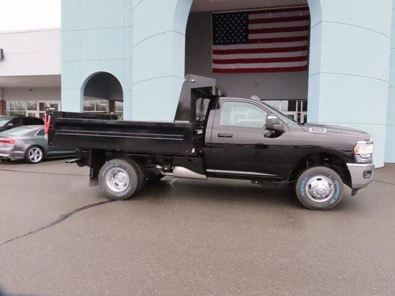 2023 RAM 3500 Chassis Cab Tradesman in a Diamond Black Crystal Pearl Coat exterior color and Diesel Gray/Blackinterior. Papas Jeep Ram In New Britain, CT 860-356-0523 papasjeepram.com 