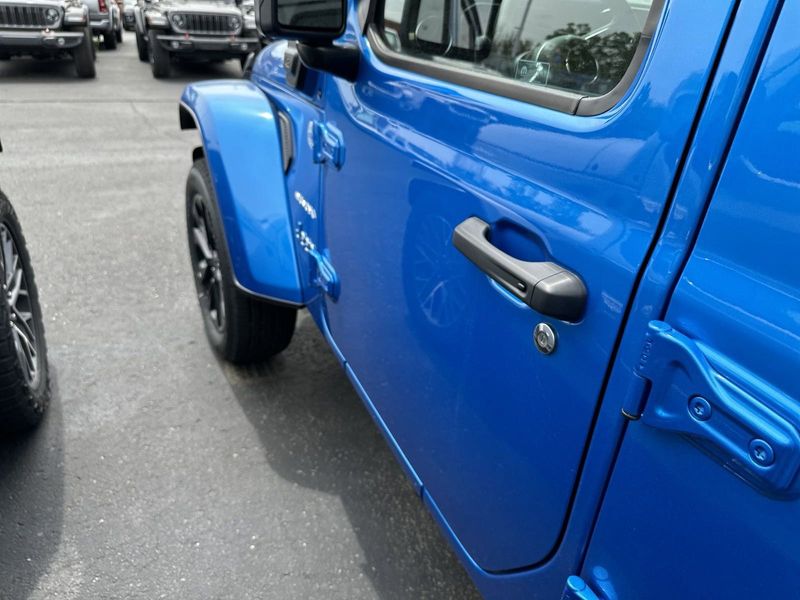2024 Jeep Wrangler 4-door Sahara 4xe in a Hydro Blue Pearl Coat exterior color. Gupton Motors Inc 615-384-2886 guptonmotors.com 