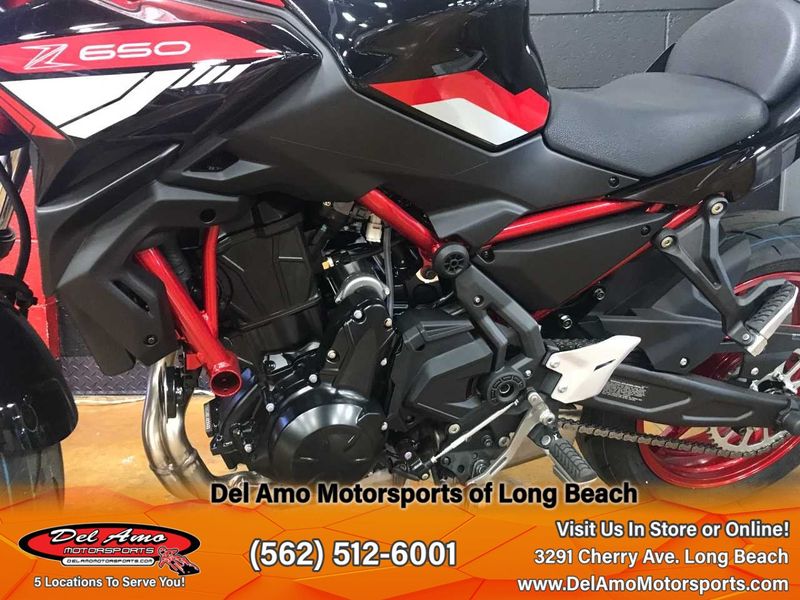 2024 Kawasaki ER650NRFAL-RD1  in a CANDY PERSIMMON RED/EBONY exterior color. Del Amo Motorsports of Long Beach (562) 362-3160 delamomotorsports.com 