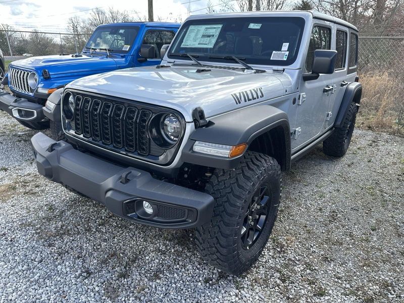 2024 Jeep Wrangler 4-door Willys in a Silver Zynith Clear Coat exterior color and Blackinterior. CDJR of Anytown 949-555-4321 pixelmotiondemo.com 