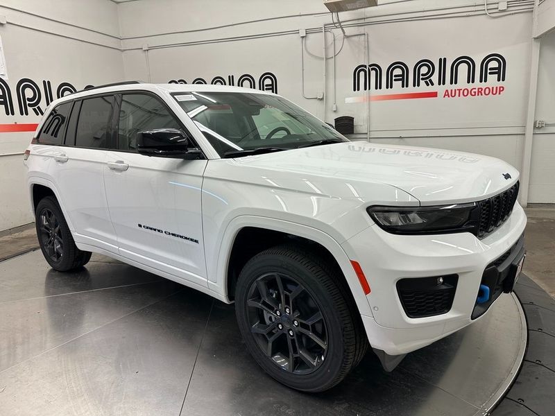 2024 Jeep Grand Cherokee Anniversary Edition 4xe in a Bright White Clear Coat exterior color and Global Blackinterior. Marina Auto Group (855) 564-8688 marinaautogroup.com 