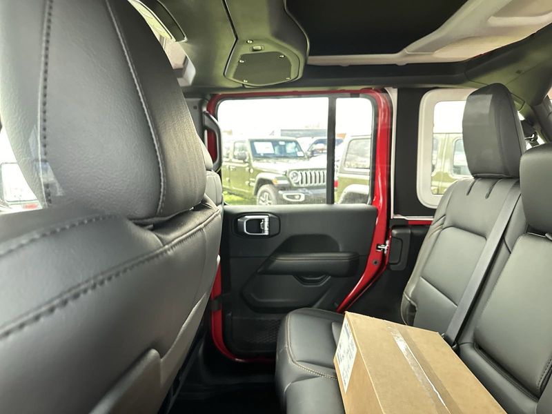 2024 Jeep Wrangler 4-door Sahara in a Firecracker Red Clear Coat exterior color. Gupton Motors Inc 615-384-2886 guptonmotors.com 
