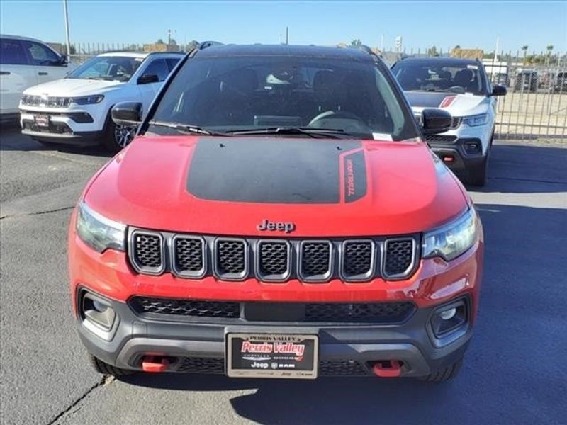 2024 Jeep Compass Trailhawk 4x4 in a Black Clear Coat exterior color and Ruby Red/Blackinterior. Perris Valley Chrysler Dodge Jeep Ram 951-355-1970 perrisvalleydodgejeepchrysler.com 