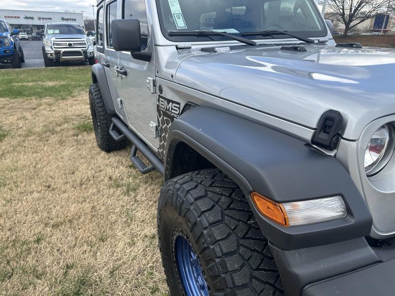 2024 Jeep Wrangler 4-door Sport S in a Silver Zynith Clear Coat exterior color and Blackinterior. Gupton Motors Inc 615-384-2886 guptonmotors.com 