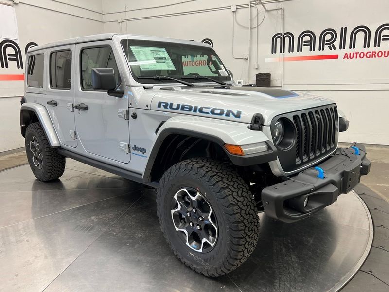 2023 Jeep Wrangler Rubicon 4xe in a Silver Zynith Clear Coat exterior color and Blackinterior. Marina Auto Group (855) 564-8688 marinaautogroup.com 