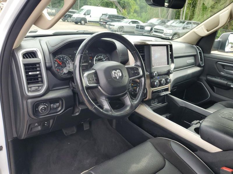 2020 RAM 1500 Laramie in a Bright White Clear Coat exterior color and Blackinterior. Johnson Dodge 601-693-6343 pixelmotiondemo.com 
