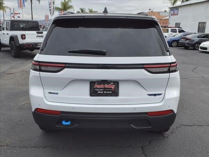 2024 Jeep Grand Cherokee Trailhawk 4xe in a Bright White Clear Coat exterior color and Global Blackinterior. Perris Valley Auto Center 951-657-6100 perrisvalleyautocenter.com 