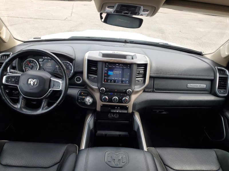 2020 RAM 1500 Laramie in a Bright White Clear Coat exterior color and Blackinterior. Johnson Dodge 601-693-6343 pixelmotiondemo.com 