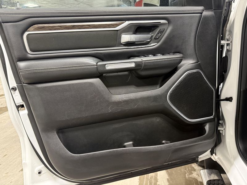 Used 2020 RAM 1500 Laramie in a Bright White Clear Coat exterior color and Blackinterior. Thys Motor Company 319-318-6640 thysmotorco.com 