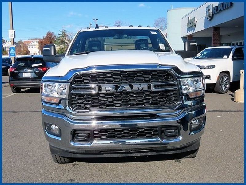2024 RAM 2500 Tradesman in a Bright White Clear Coat exterior color and Diesel Gray/Blackinterior. Papas Jeep Ram In New Britain, CT 860-356-0523 papasjeepram.com 
