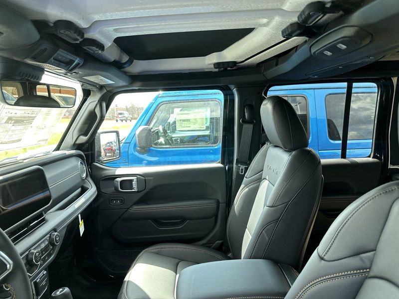 2024 Jeep Wrangler 4-door Sahara in a Black Clear Coat exterior color. Gupton Motors Inc 615-384-2886 guptonmotors.com 