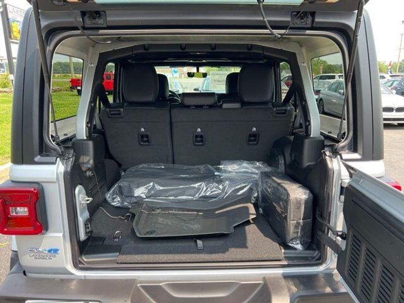 2023 Jeep Wrangler Sahara 4xe in a Silver Zynith Clear Coat exterior color and Blackinterior. Lakeshore CDJR Seaford 302-213-6058 lakeshorecdjr.com 