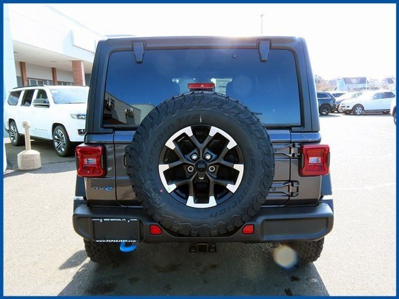 2024 Jeep Wrangler 4xE 4-DOOR RUBICON 4xe in a Granite Crystal Metallic Clear Coat exterior color. Papas Jeep Ram In New Britain, CT 860-356-0523 papasjeepram.com 