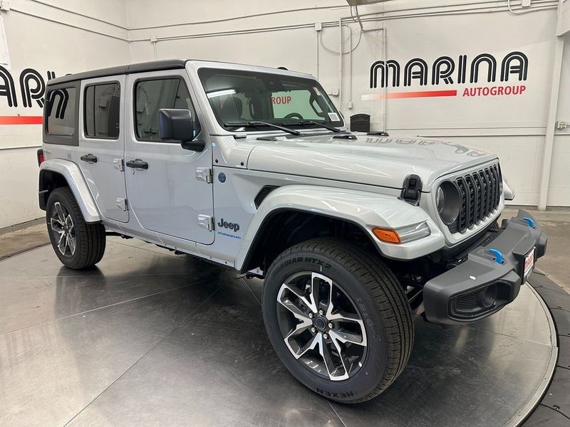 2024 Jeep Wrangler 4-door Sport S 4xe in a Silver Zynith Clear Coat exterior color and Blackinterior. Marina Auto Group (855) 564-8688 marinaautogroup.com 